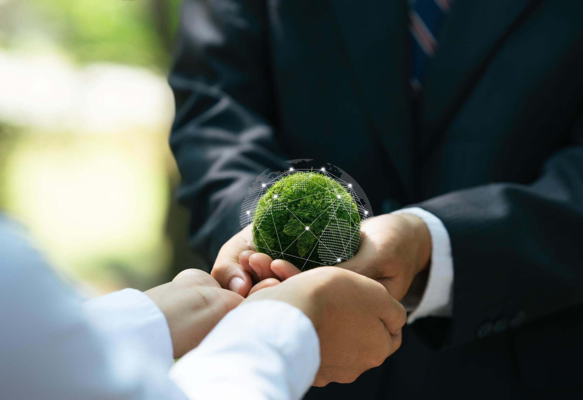hands passing earth